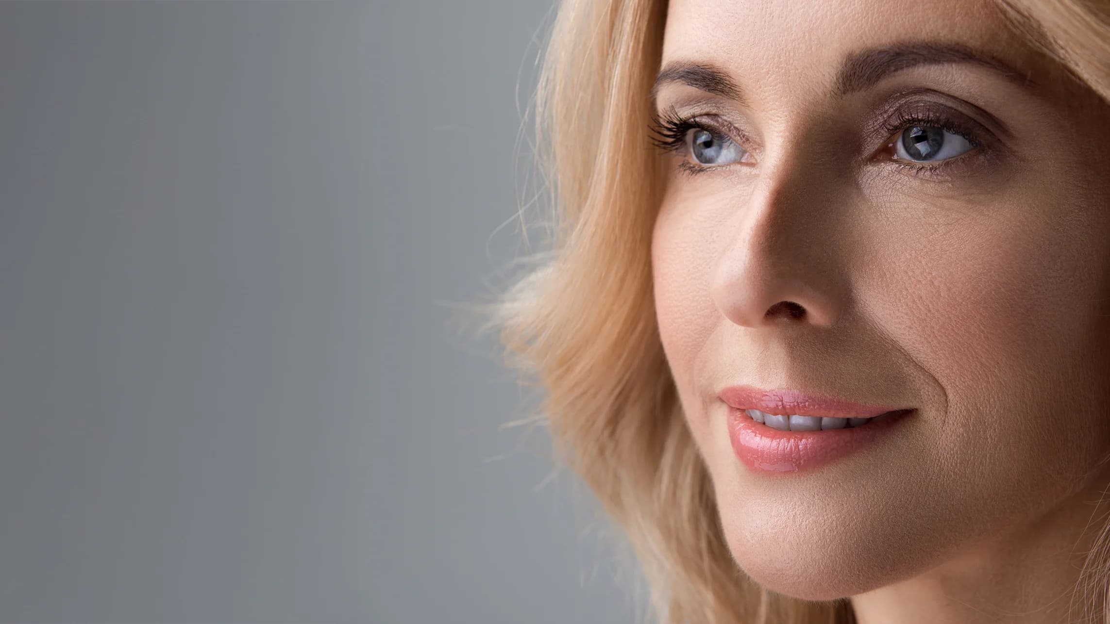 blonde smiley woman with beautiful eyebrows