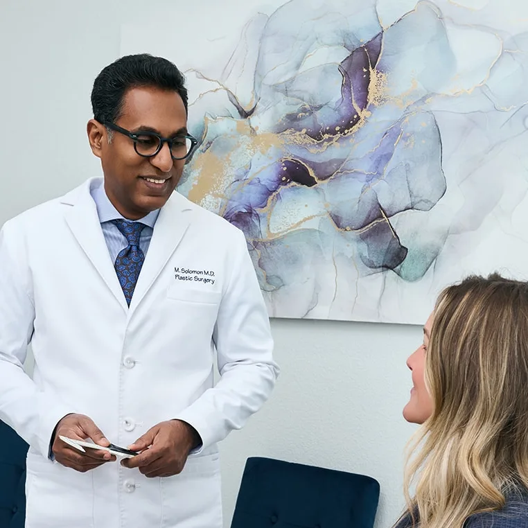 Doctor Solomon with his patient consulting in his practice in Frisco, Texas
