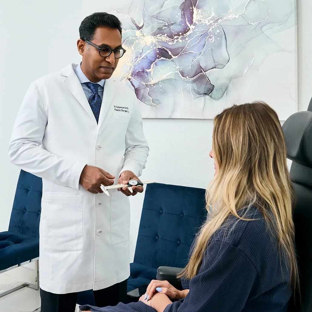 Dr. Solomon with a customer in the Frisco, TX office.