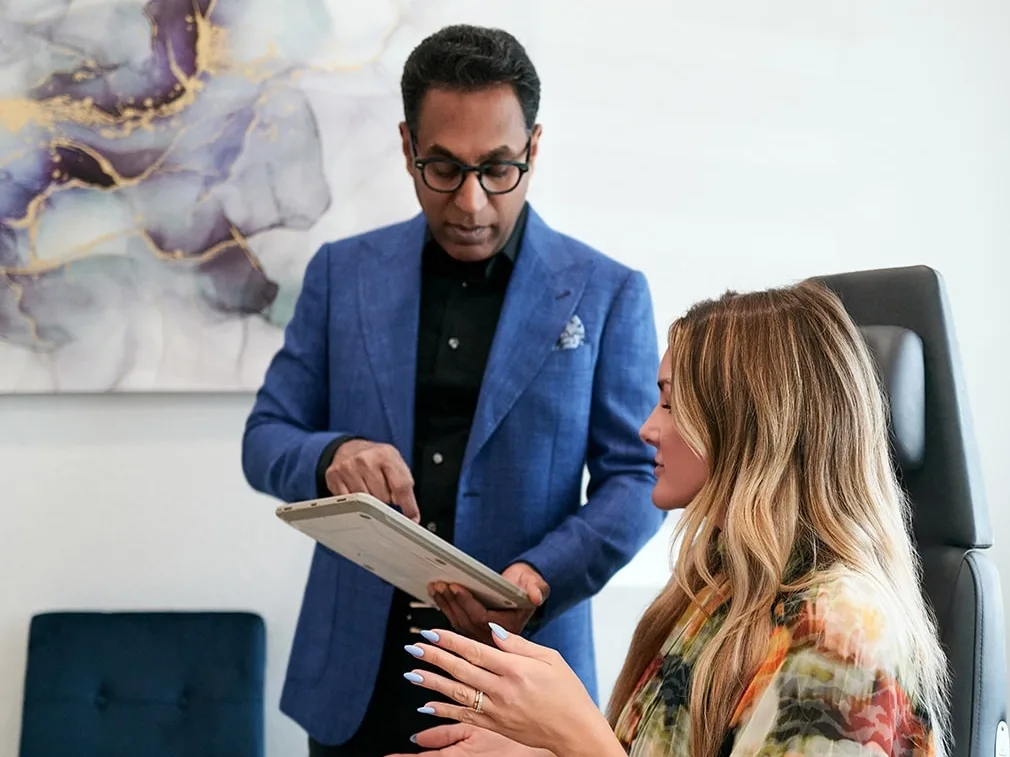 Dr. Solomon consulting with his patient in his office in Frisco, Texas