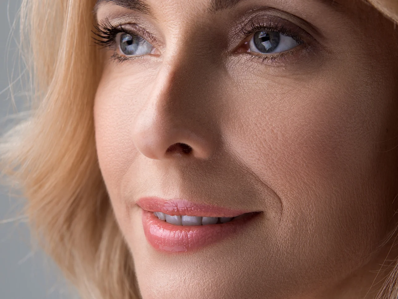 blonde smiley woman with beautiful eyebrows