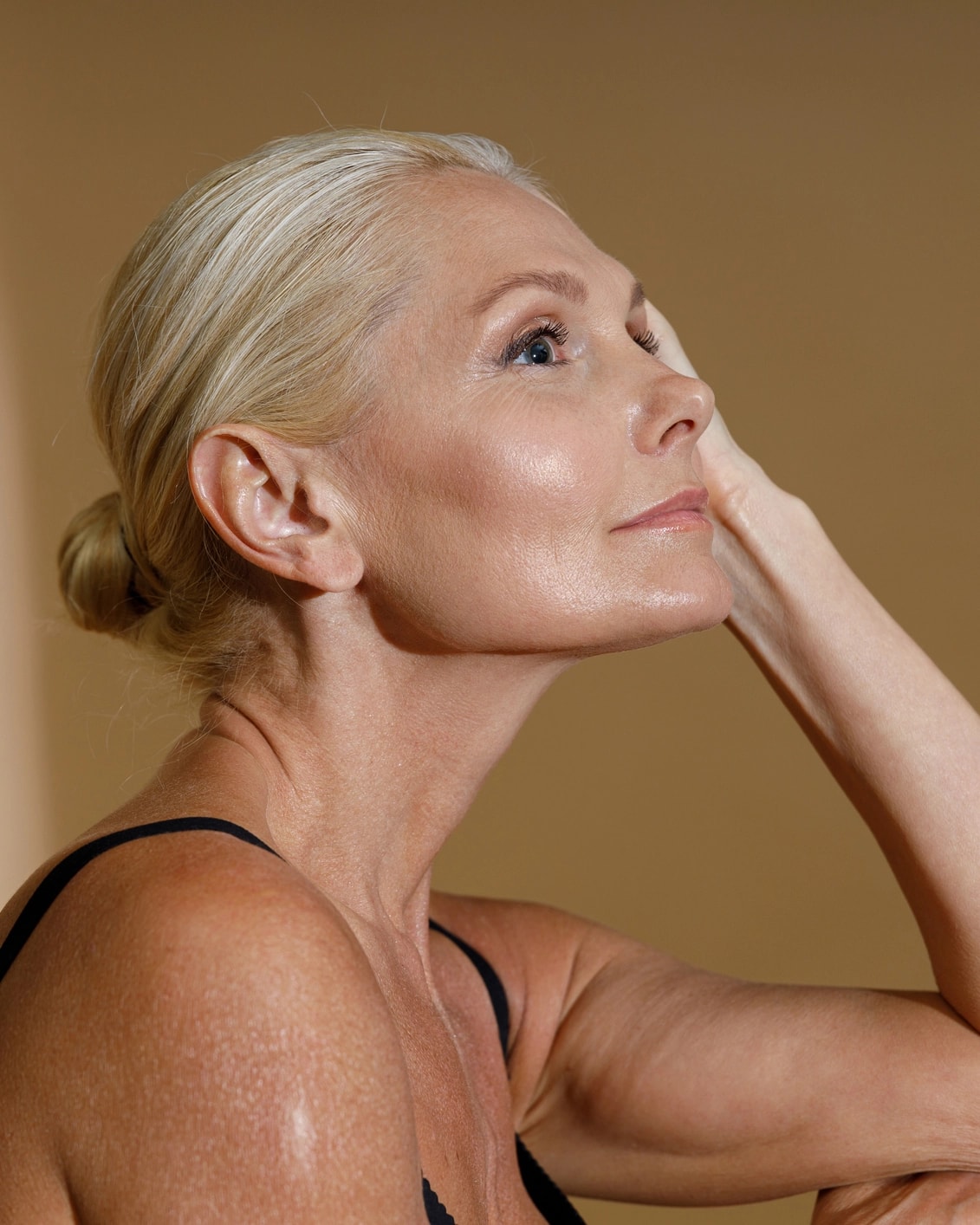 Attractive woman after a successful neck lift procedure.