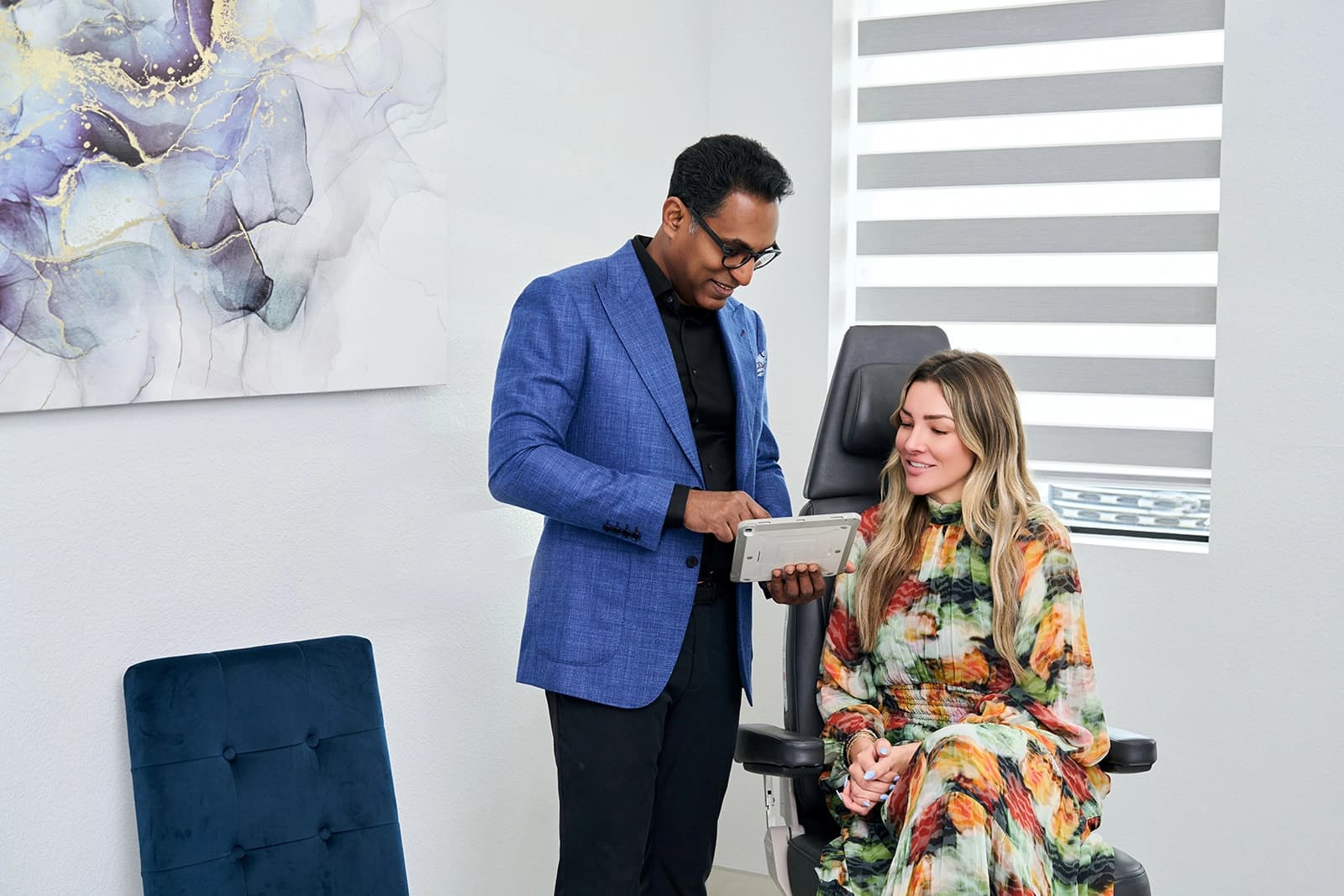 Dr. Solomon discussing breast lift procedures with a patient.